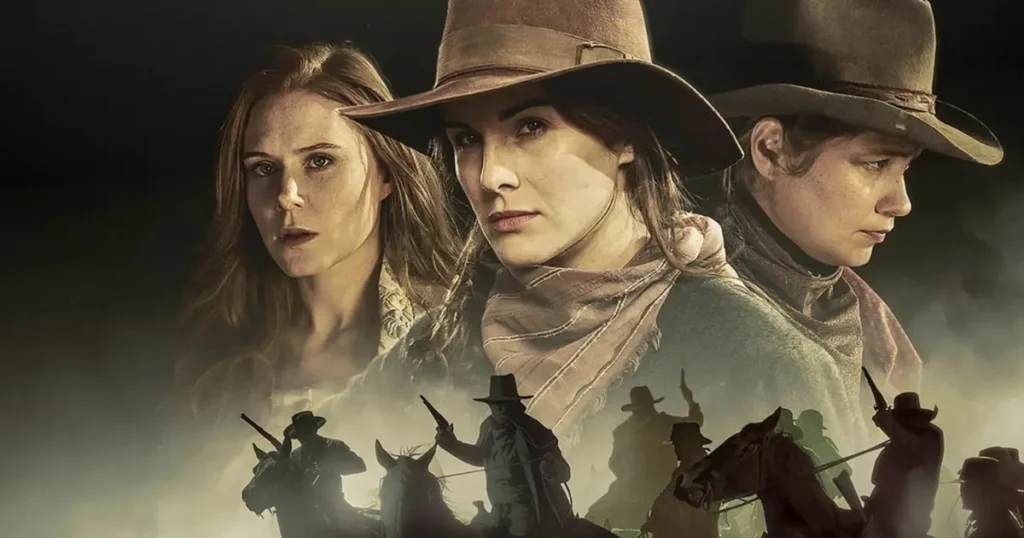 The poster for Godless puts the faces of Christiane Seidel, Michelle Dockery and Merritt Wever front and centre in tight close-ups. Below them one can see a smoky terrain where a band of mounted riders with their weapons make their presence known in silhouette.
