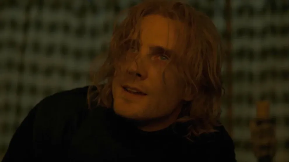 Prince Daeron Targaryen with long wavy hair looking upward inside a tent in House of the Dragon.