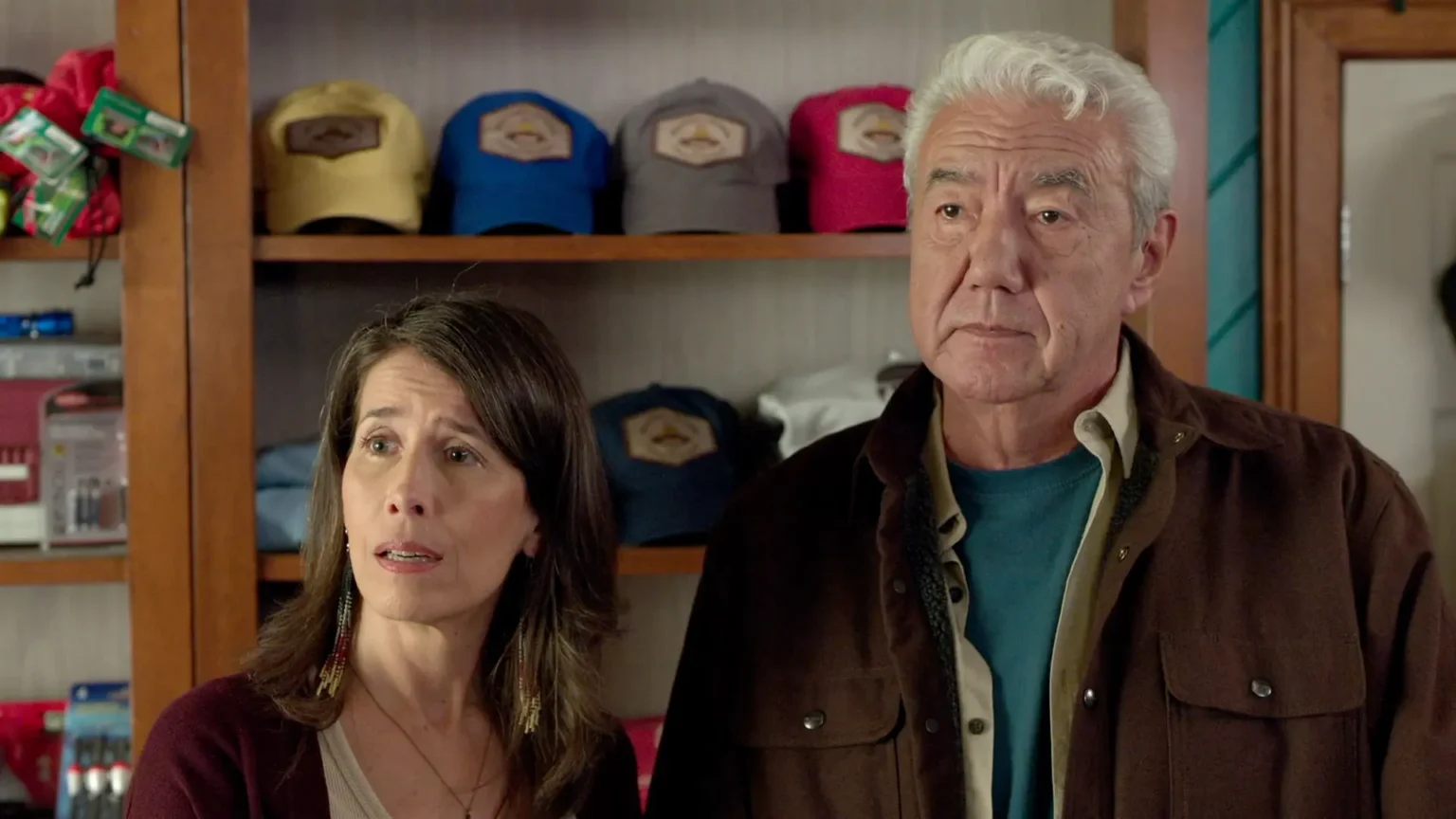 Who is Frank Cranebear in Sullivan’s Crossing? Exploring the Beloved Character’s Role and Impact Tom Jackson as Frank Cranebear and Andrea Menard as Edna Cranebear looking concerned in a store in Sullivan’s Crossing.