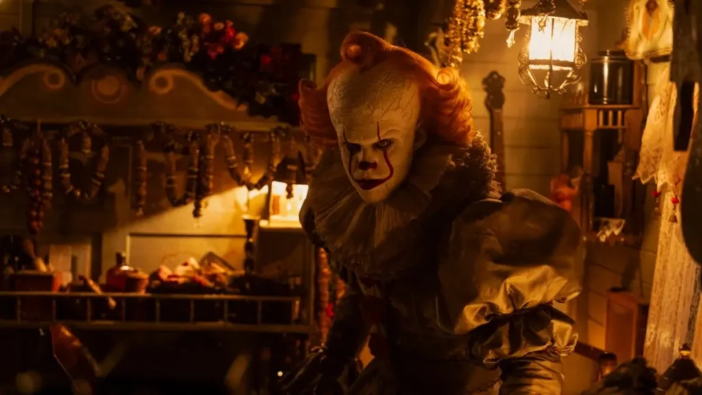 ‘It: Welcome to Derry’ Season 2 Will Take Place in 1935, Director Confirms Bill Skarsgård as Pennywise the Dancing Clown emerging from a dark, dimly lit room in IT: Welcome to Derry.