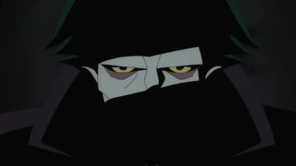Animated close-up of the Joker with dark green spiky hair and pale skin wearing a high collar that hides his mouth in Batman: Caped Crusader.