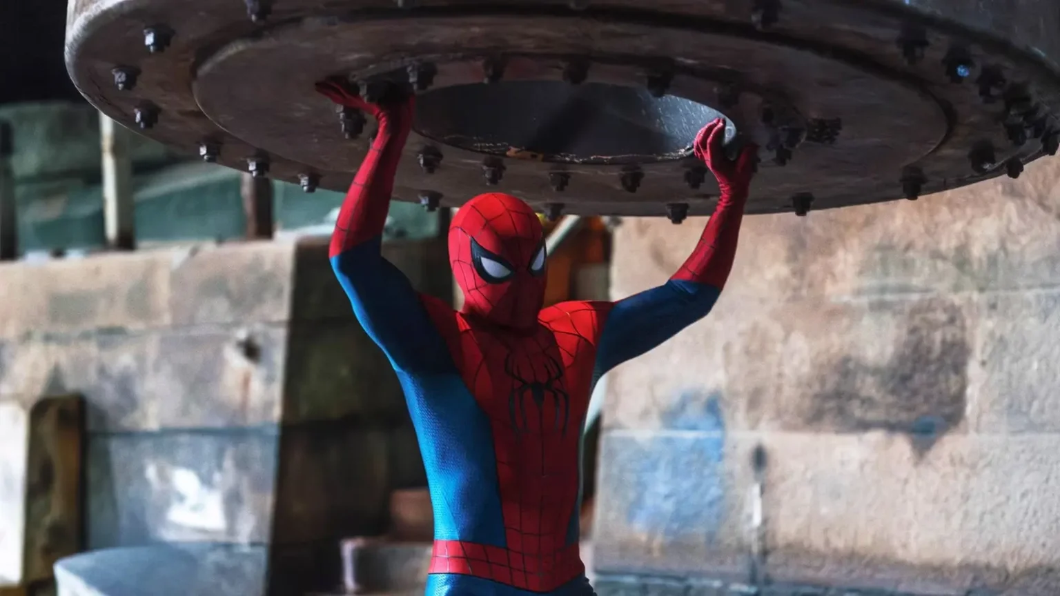 Spider-Man: Brand New Day Closing In on $700 Million at the Domestic Box Office Spiderman holding up a large piece of metal in Brand New Day