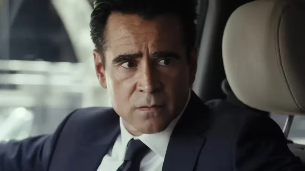 Colin Farrell looking intently over his shoulder while sitting in the driver's seat of a car in Sugar.