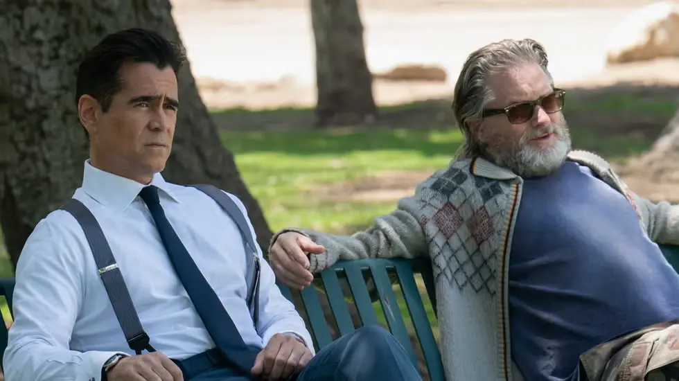 Colin Farrell and Jason Butler Harner sitting side by side on a park bench in Sugar.